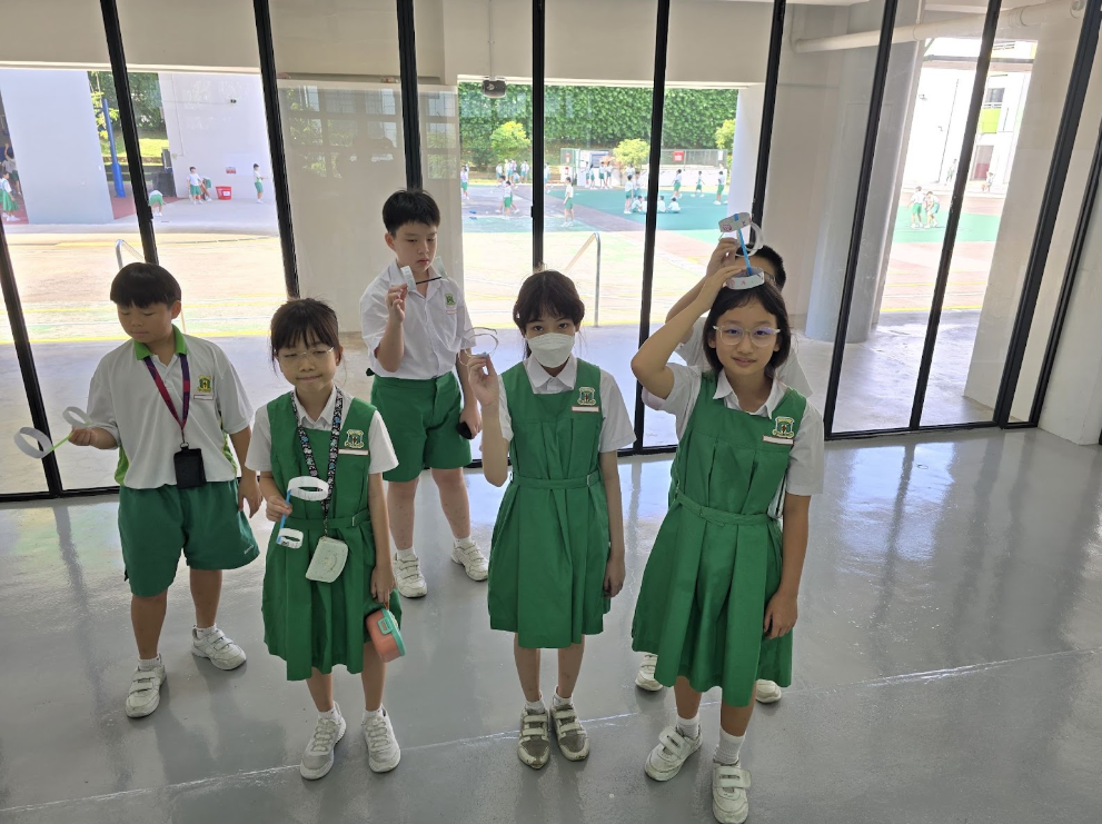 A group of students showcasing their work 2
